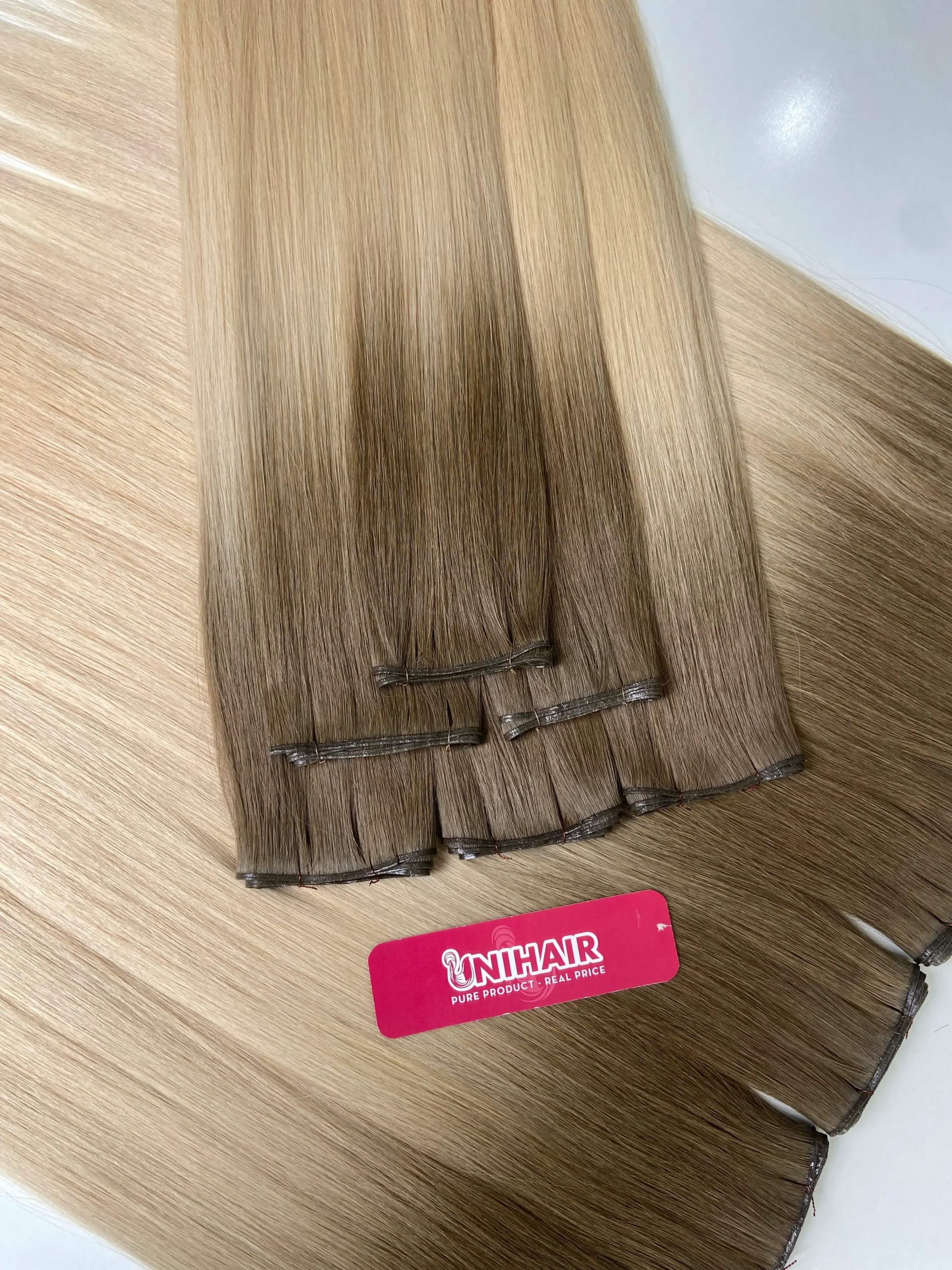 Genius Weft low-profile weft attachment close-up from Unihairvn Vietnam hair factory Genius Weft low-profile weft attachment close-up from Unihairvn Vietnam hair factory